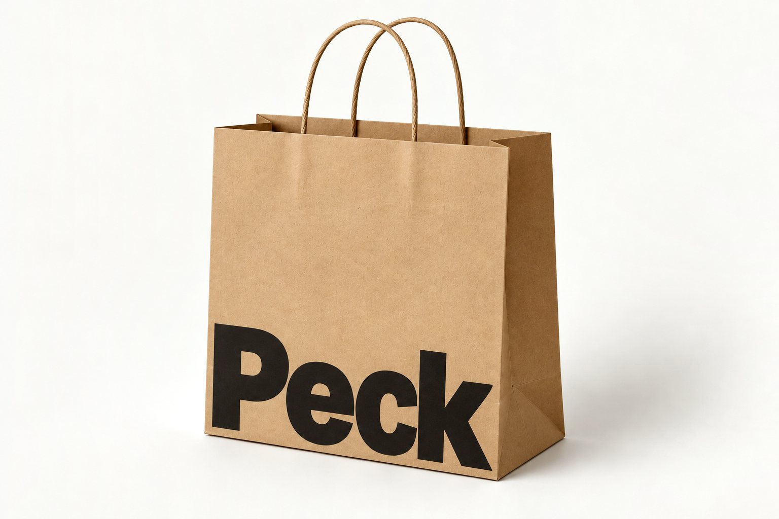 Kraft twisted-handle takeaway bag printed with a large black “Peck” wordmark low across the face