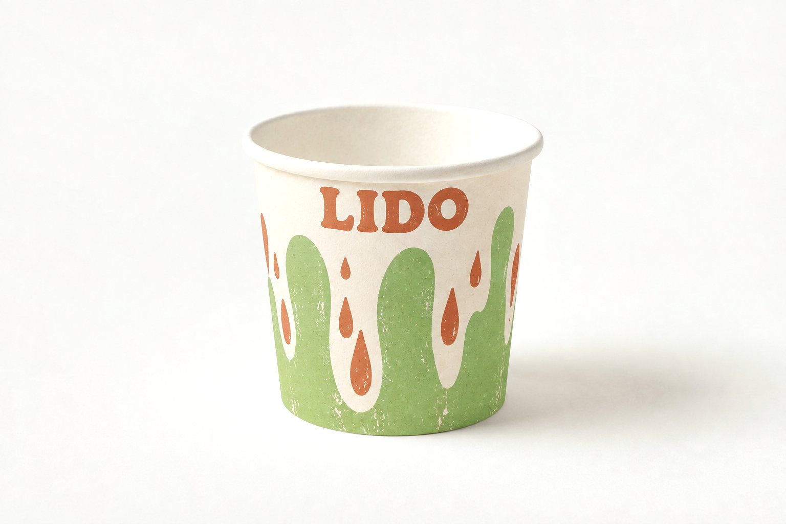 12 oz paper ice cream tub printed with the terracotta “LIDO” drip design